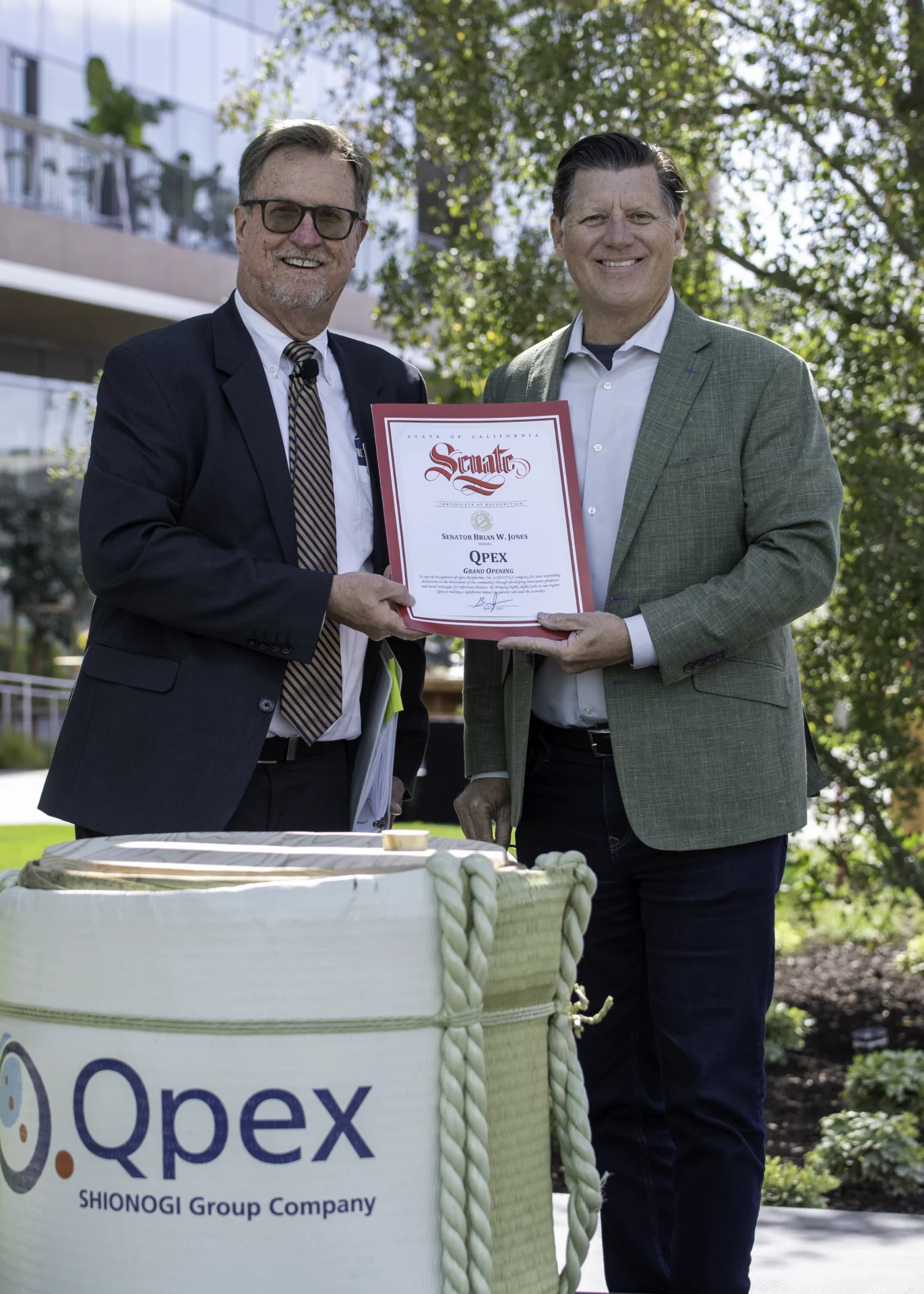 Senator Brian Jones presents Michael Dudley with a certificate of recognition from the California State Senate.