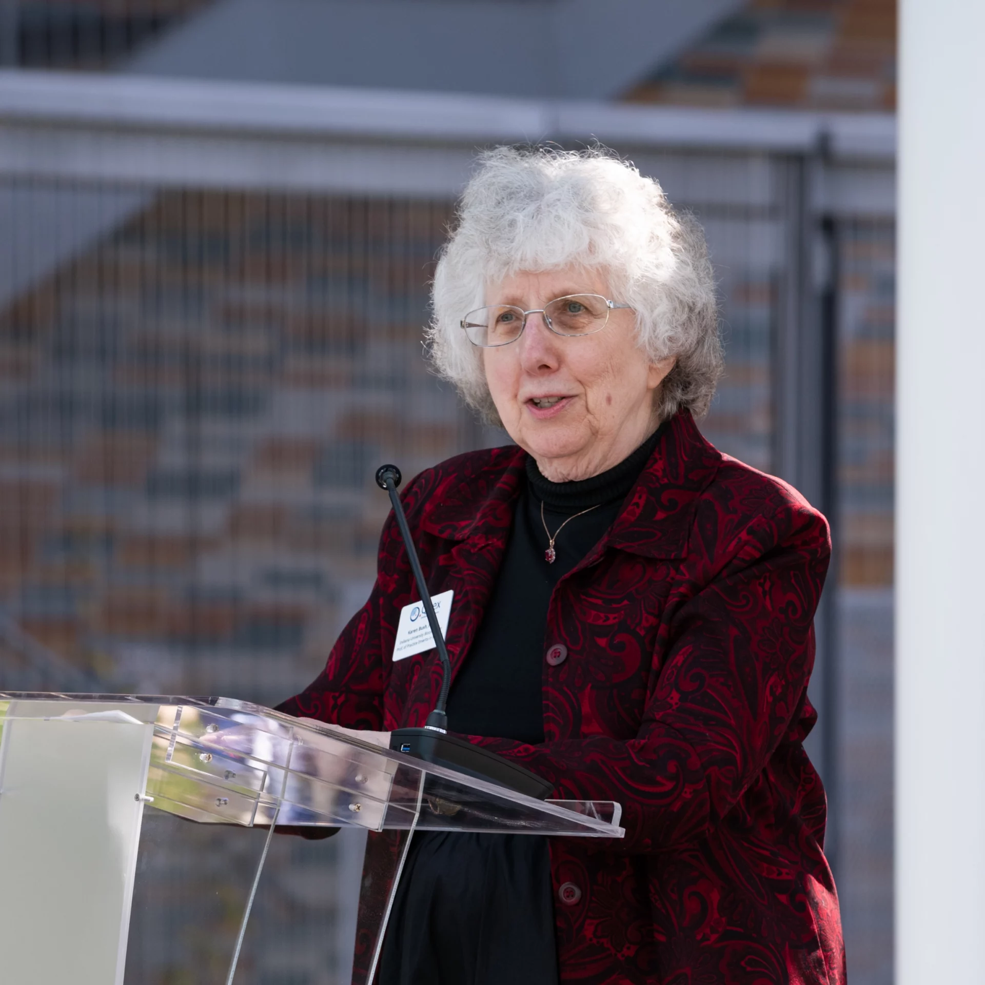 Karen Bush speaking at the podium.