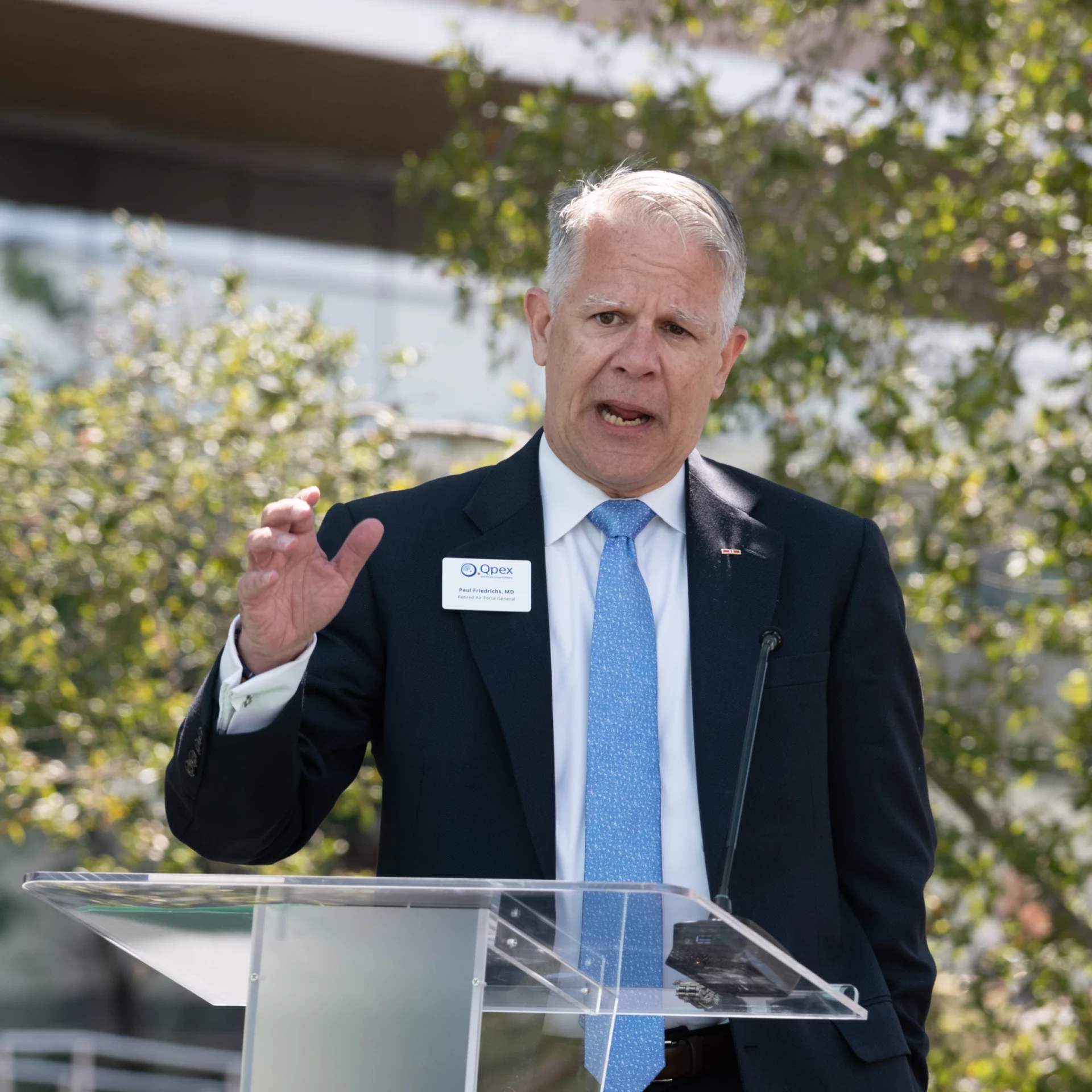 Paul Friedrichs speaking at the podium.